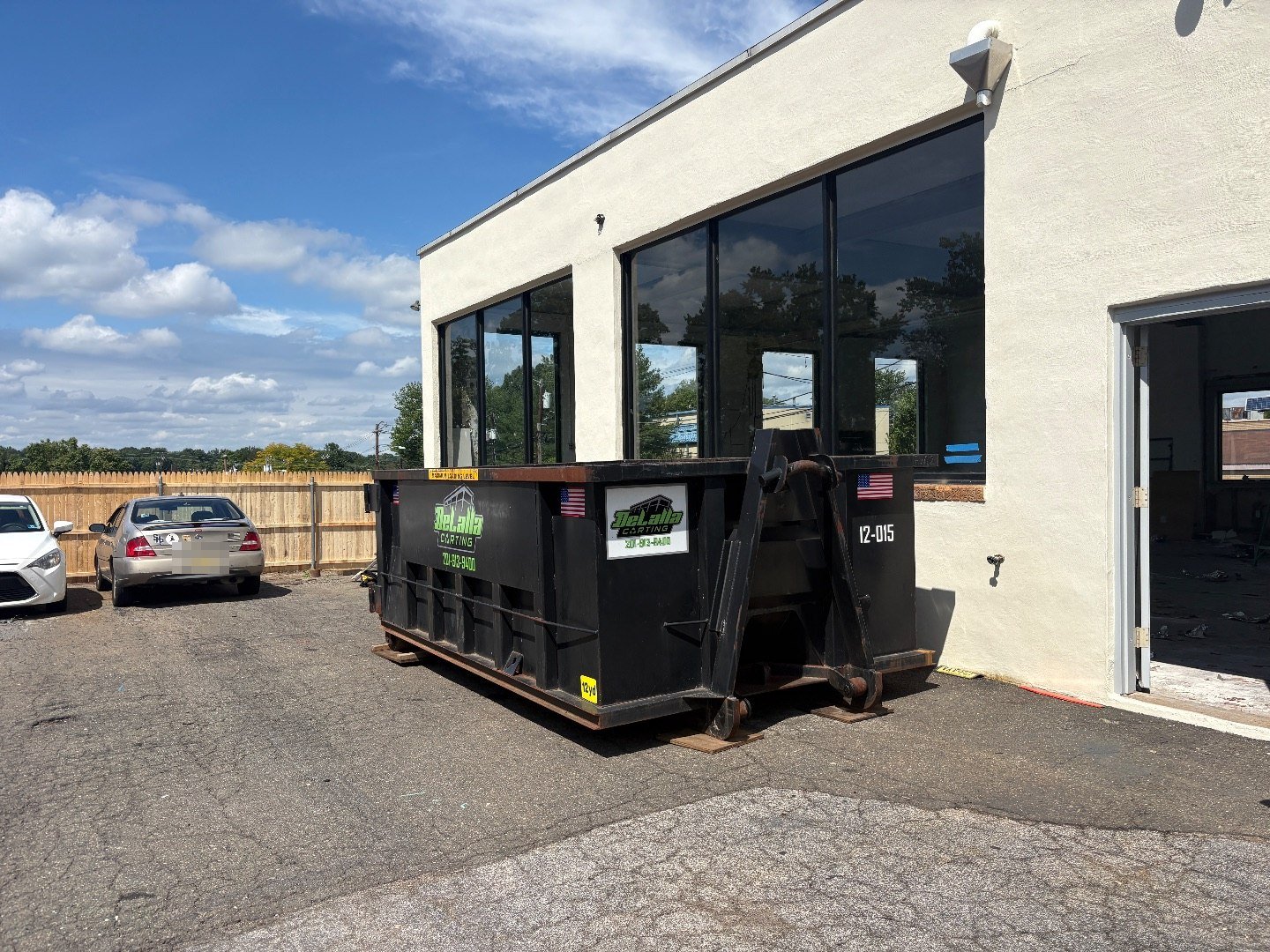 12-yard dumpster outside a commercial building during an interior gut-out in Westwood, NJ.