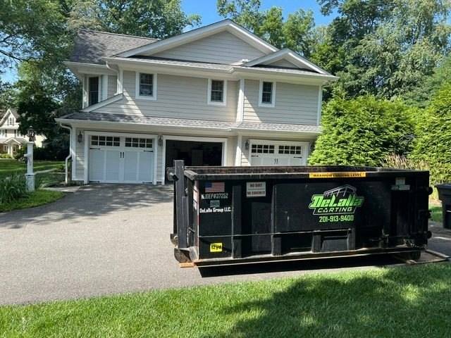 12-yard dumpster on an asphalt driveway in Glen Rock, NJ